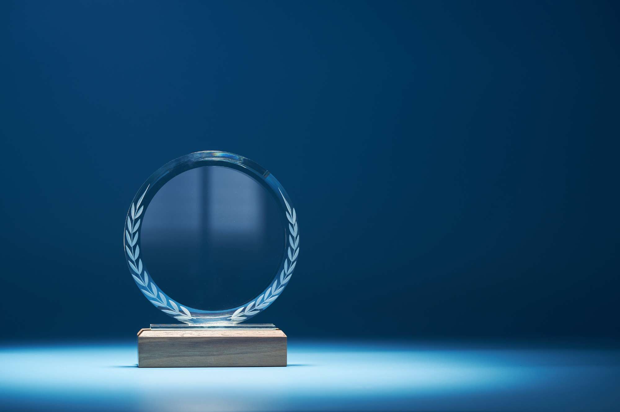 glass trophy with a blue blackground