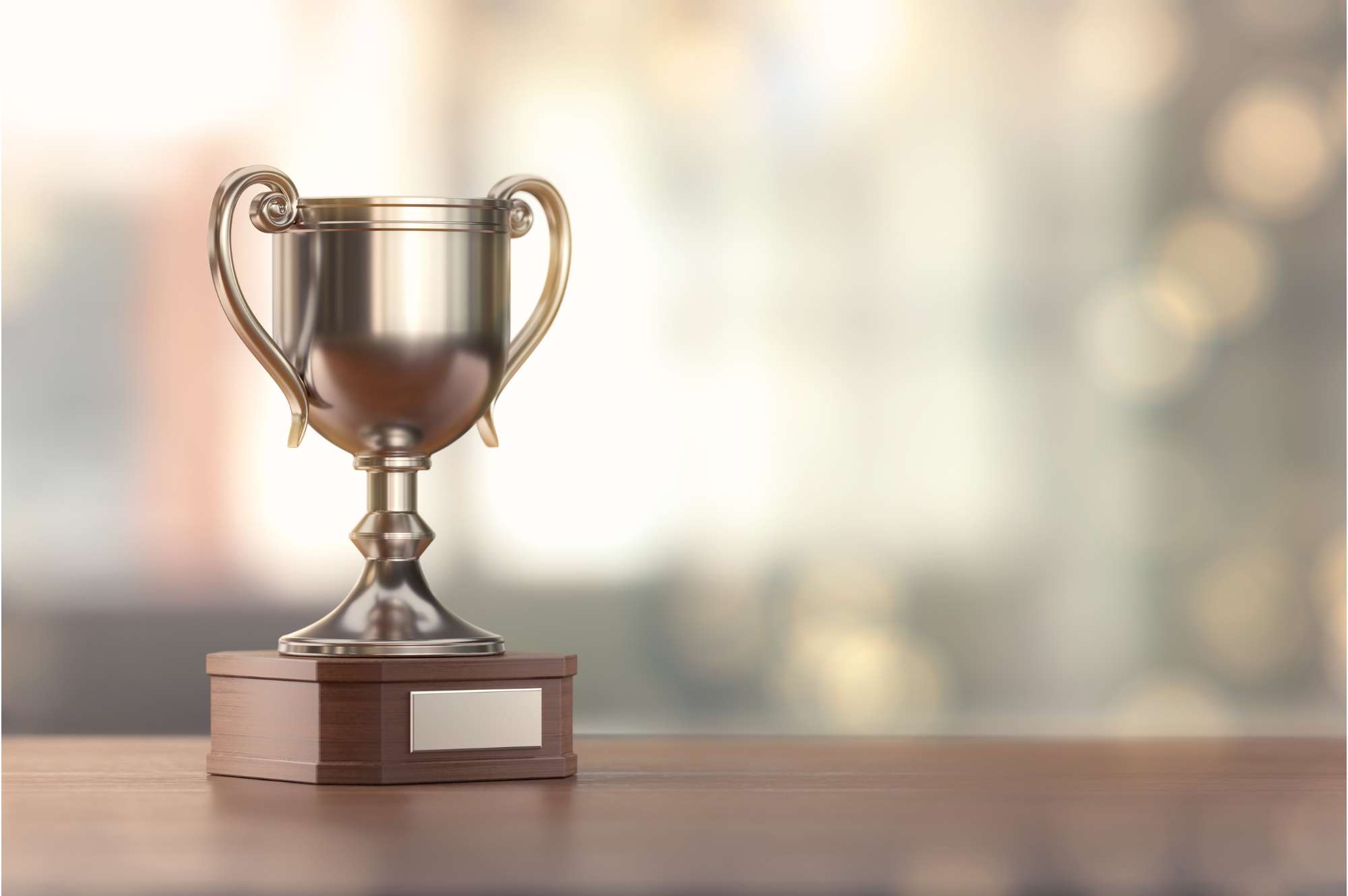 Image of a silver trophy on a desk