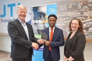 Regional Electrical Award Winner Kenneth Ajibade from London being presented with his trophy by Chris Claydon and Clair Bradley of JTL
