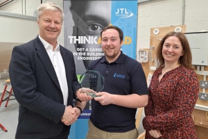 Regional Electrical Award Winner Chris Lintern from Yeovil being presented with his trophy by Chris Claydon and Clair Bradley of JTL